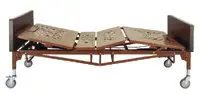 Foldable metal bed frame on wheels with adjustable sections.