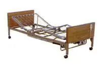 A hospital bed with adjustable sections and wheels.