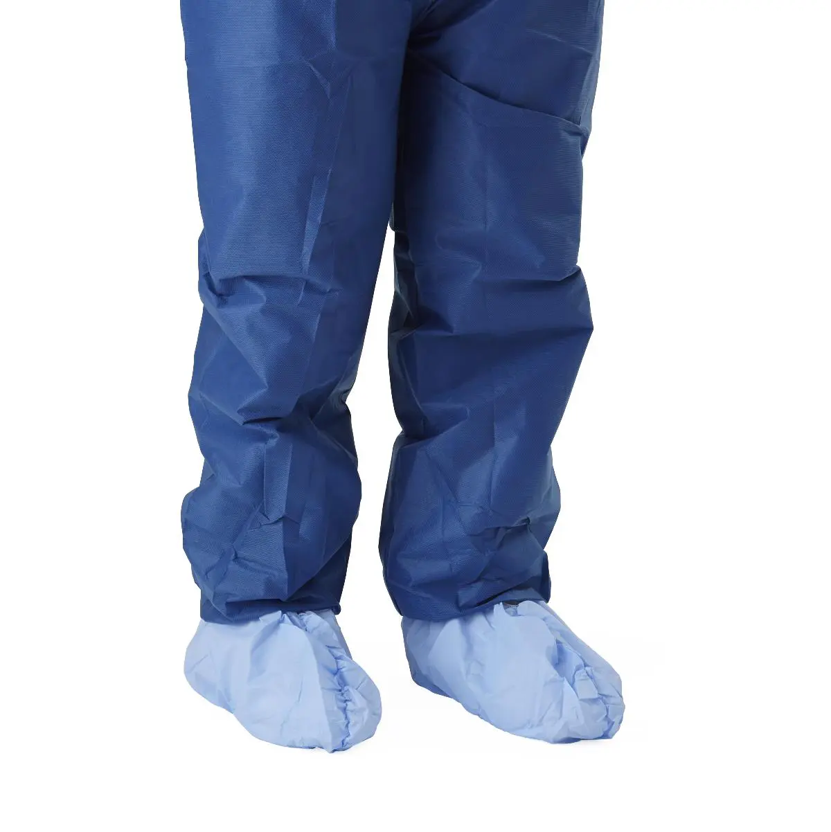 Blue disposable shoe covers worn over pants.