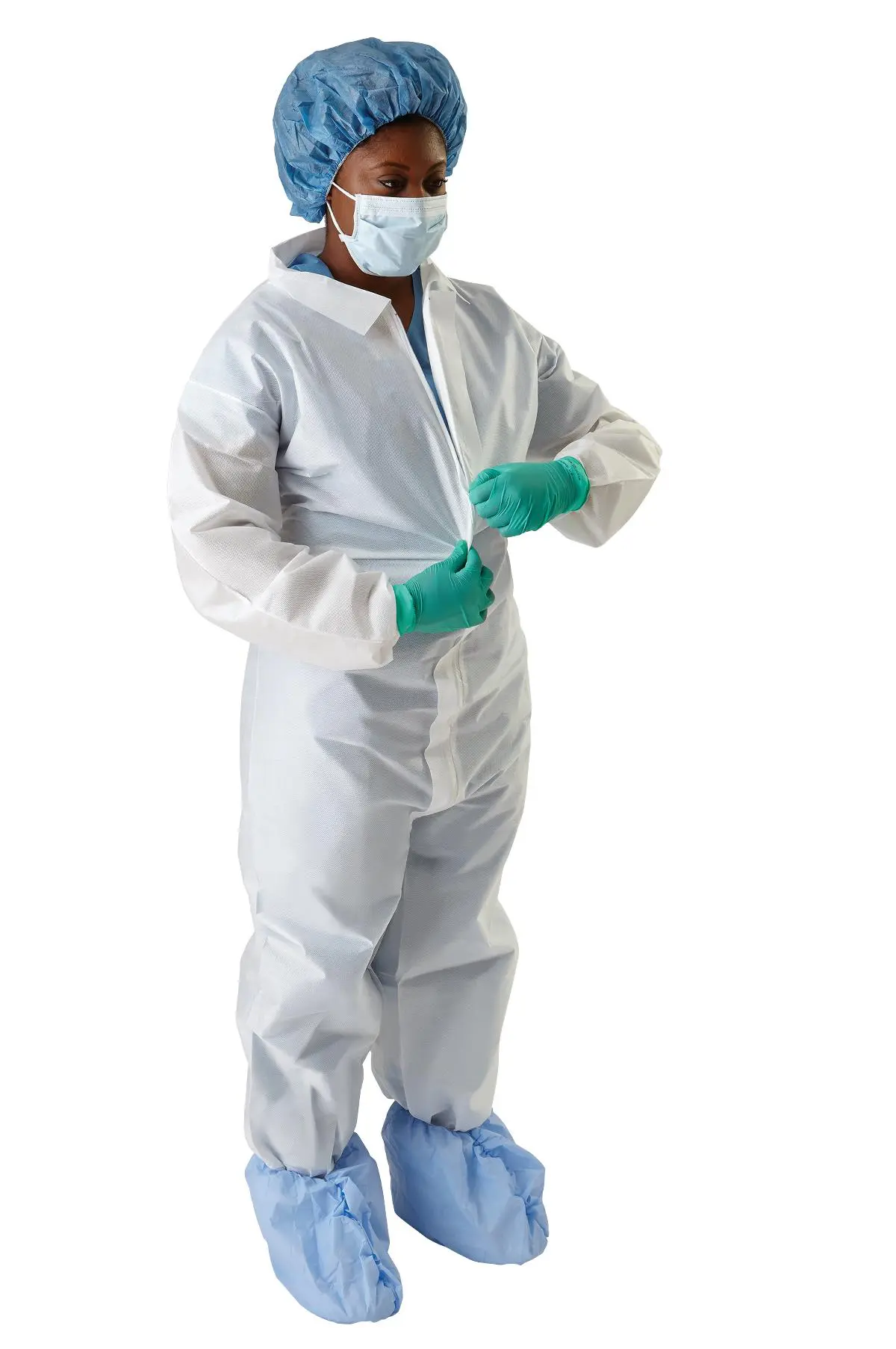 Person wearing full protective coverall and green gloves.