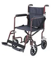 Compact foldable wheelchair with footrests and arm supports.