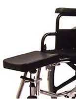 Close-up of a wheelchair footrest and part of the seat frame.