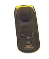 A handheld remote control with multiple buttons and a joystick.