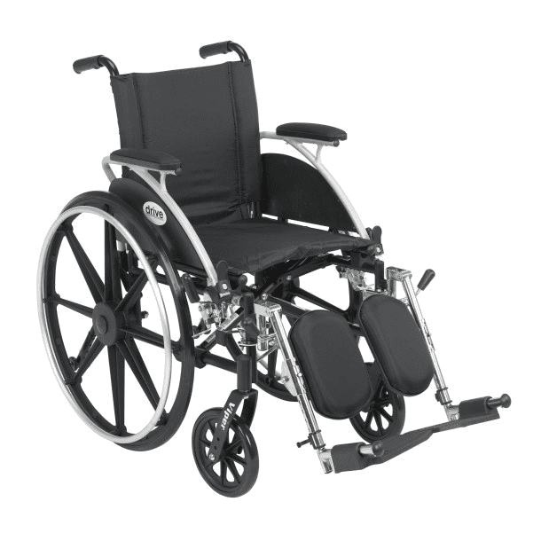 A black manual wheelchair with large rear wheels and footrests.