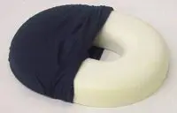 A white neck pillow partially covered with a black fabric sleeve.