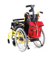 A wheelchair with a red backpack attached to the backrest.