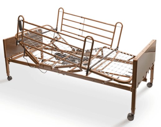 A hospital bed with adjustable metal frame and wooden headboard.