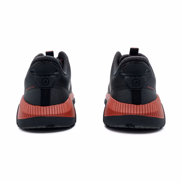 Rear view of black and red athletic shoes on white background.