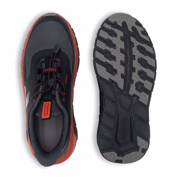 Pair of black and red sports shoes with rugged soles.