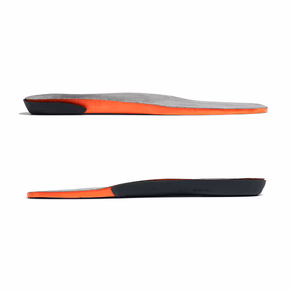 Two views of a slim, modern shoe insole with black and orange colors.