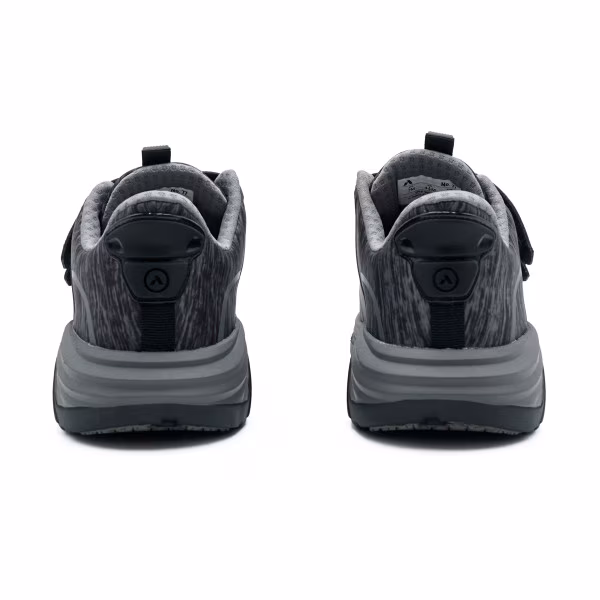 Rear view of black athletic shoes with thick soles.