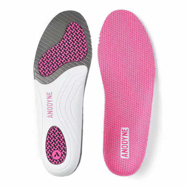 Pair of pink and white shoe insoles with cushioning zones.