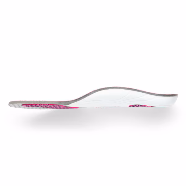 A sleek, curved, white and pink ergonomic spoon.